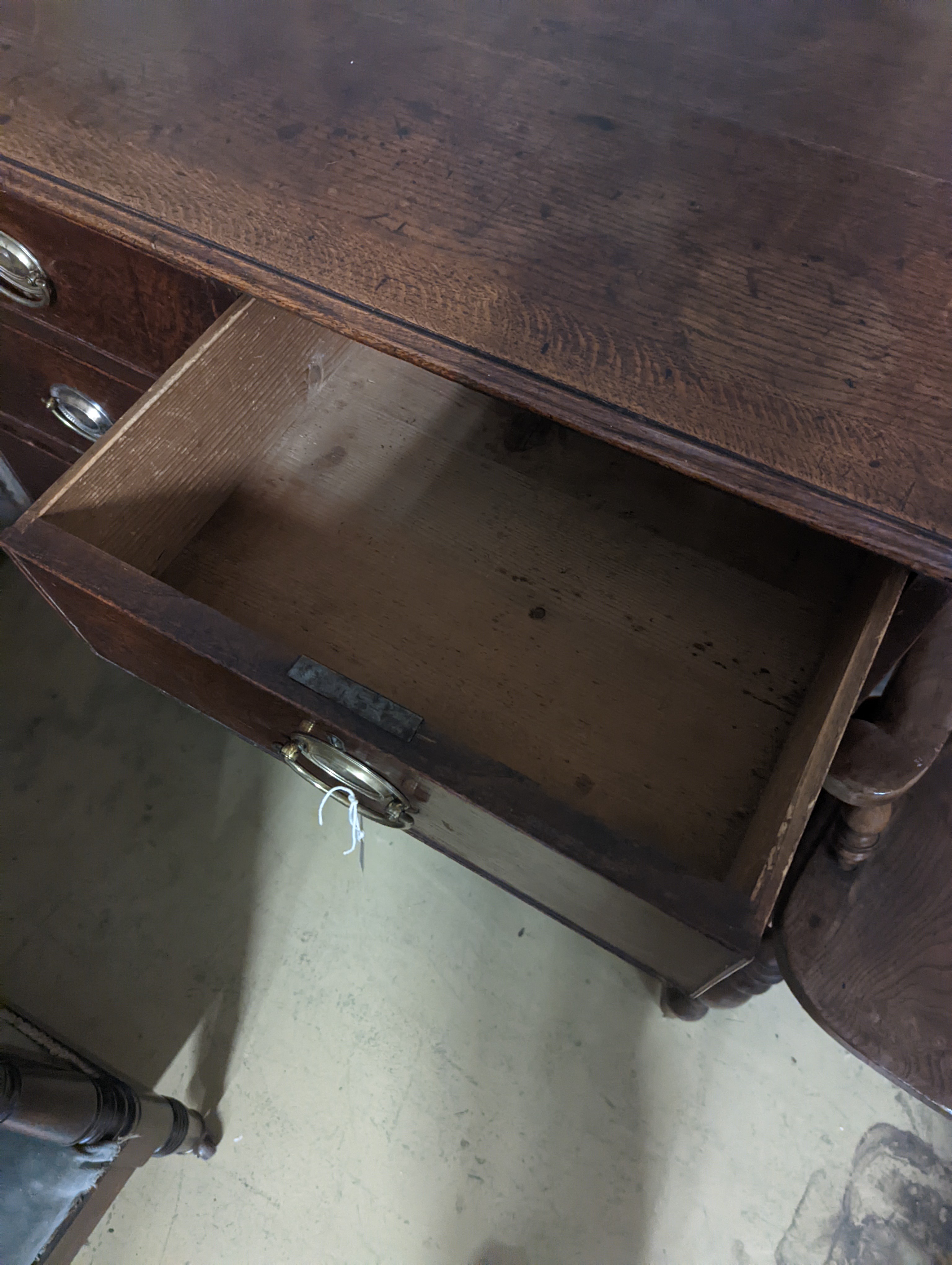 A George III oak chest of two short and three long graduated drawers, . W-94cm, D-51cm, H-99cm.